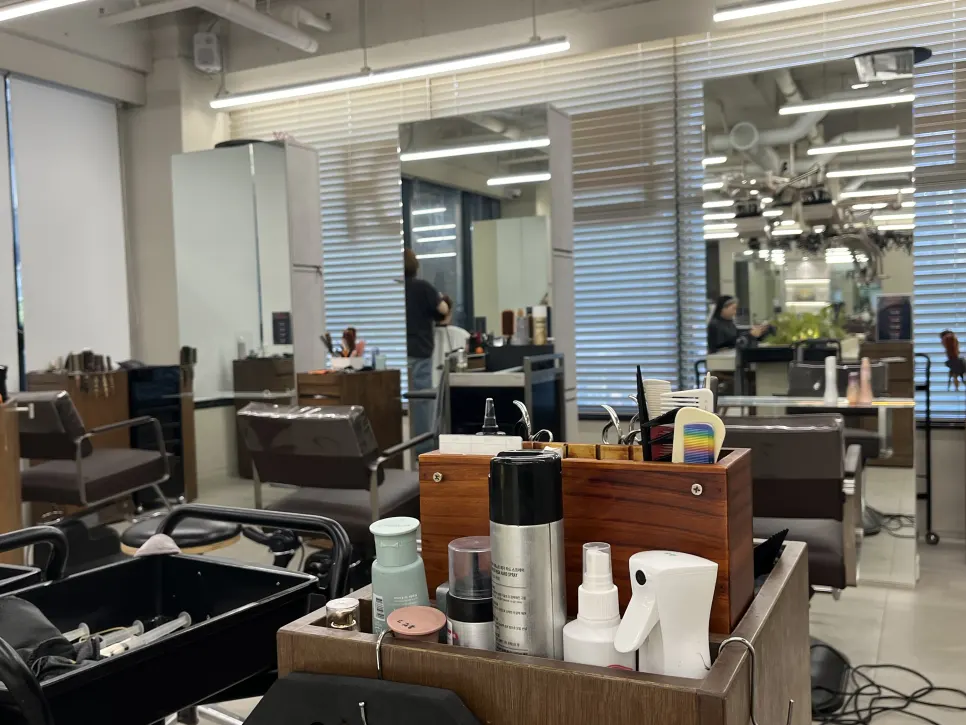 Hair products displayed on one side of the salon