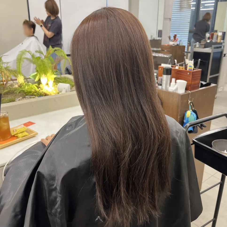 Hair before dyeing, showing patchy color and gray hairs