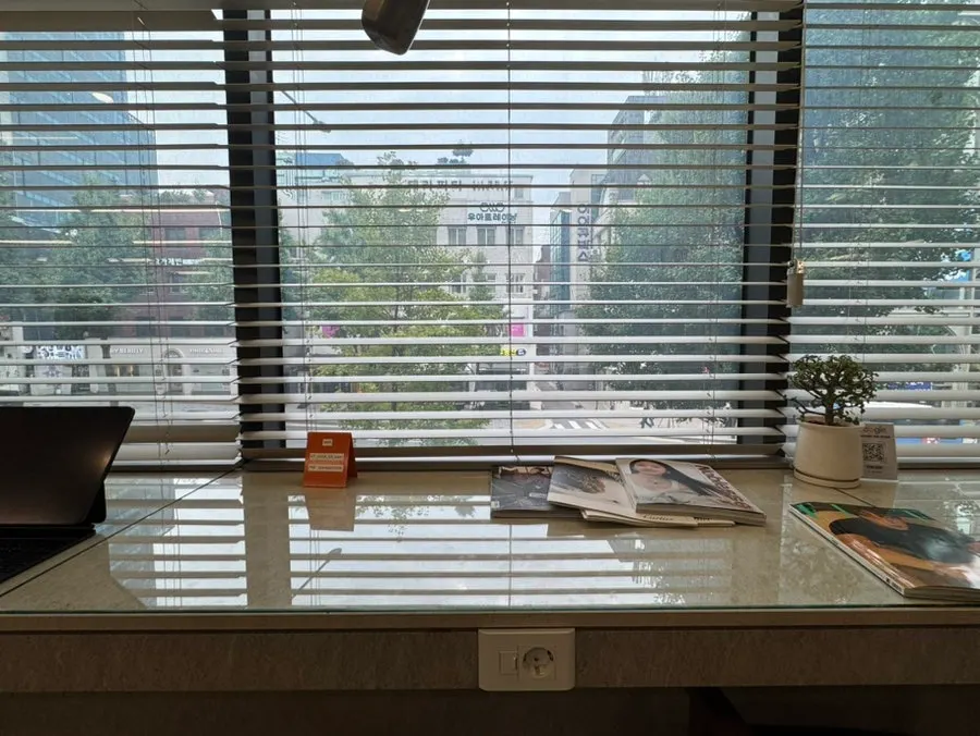 Treatment seat with outlet and a wall bookshelf