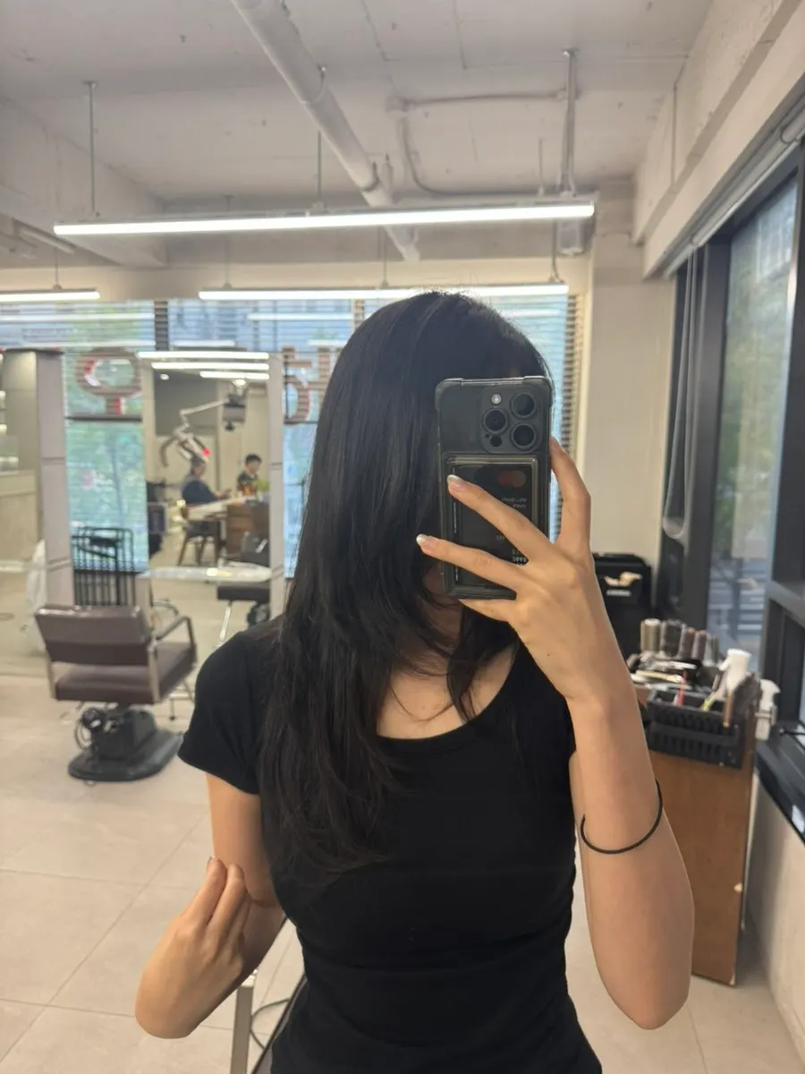 Blow-drying a layered cut after scalp care