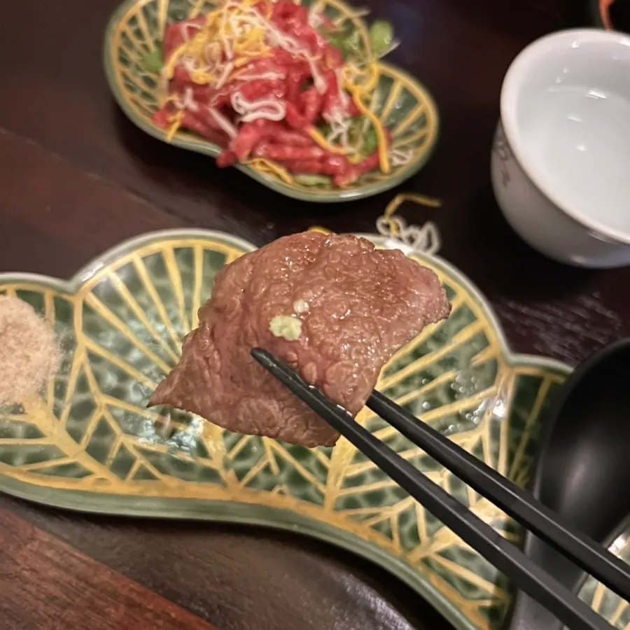 The first bite of beef grilled over the charcoal