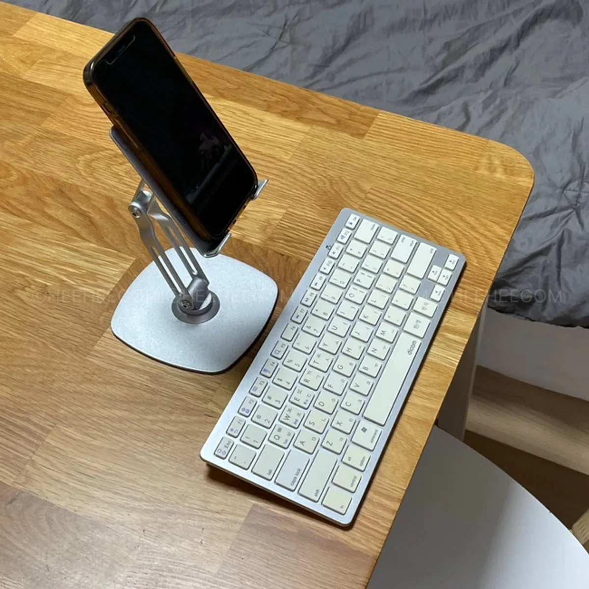 Blog-posting setup with a wireless keyboard and stand