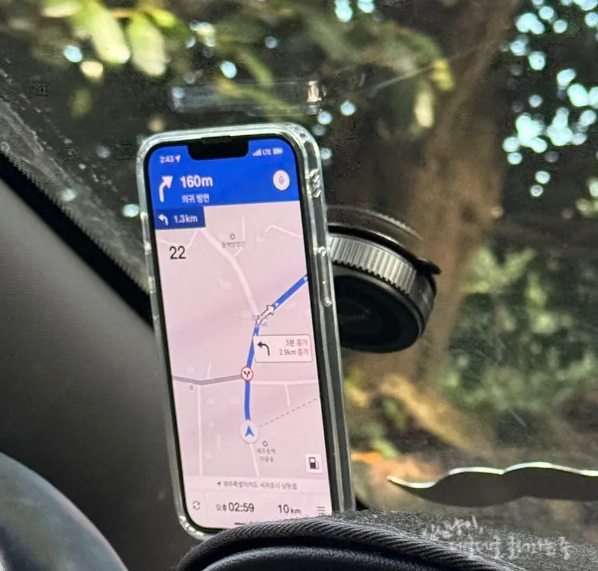 Phone mount attached to a flat surface