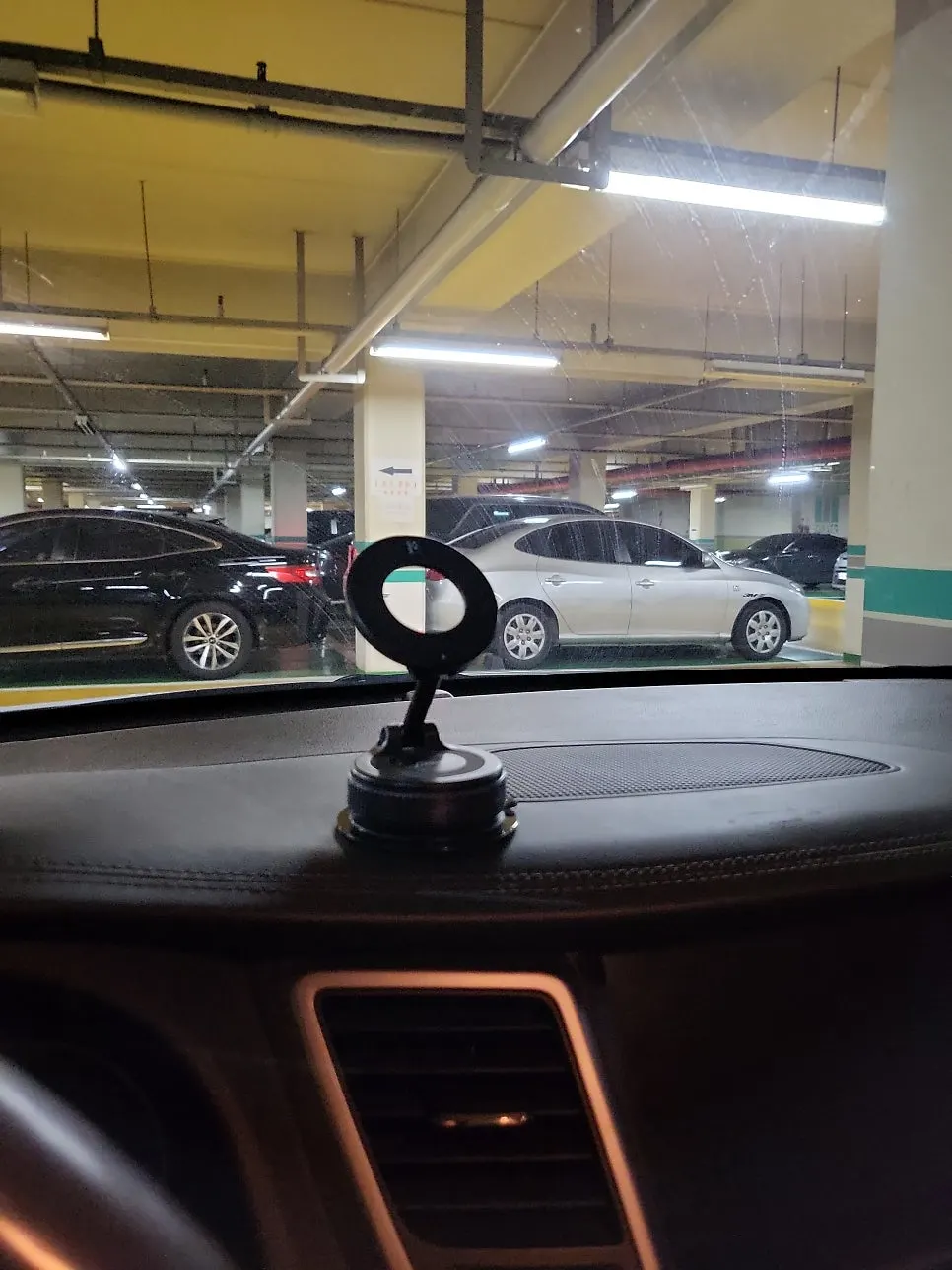 Car phone mount holding a smartphone