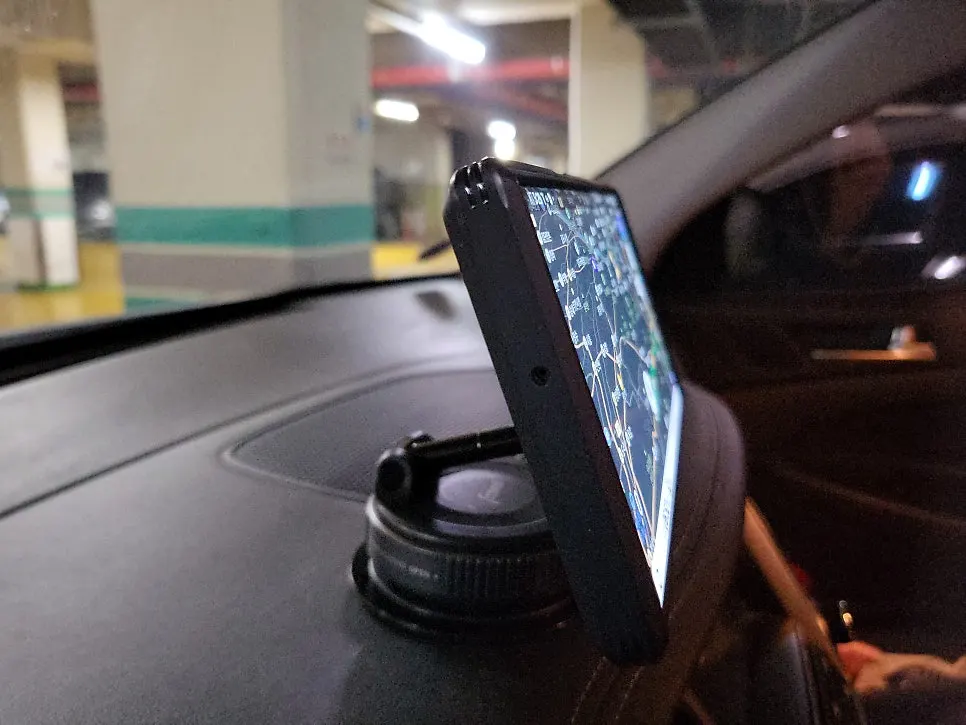 Dashboard-mounted phone holder