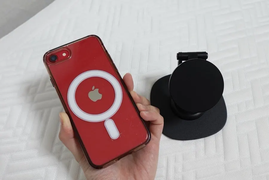 Phone stand that allows a charging cable connection