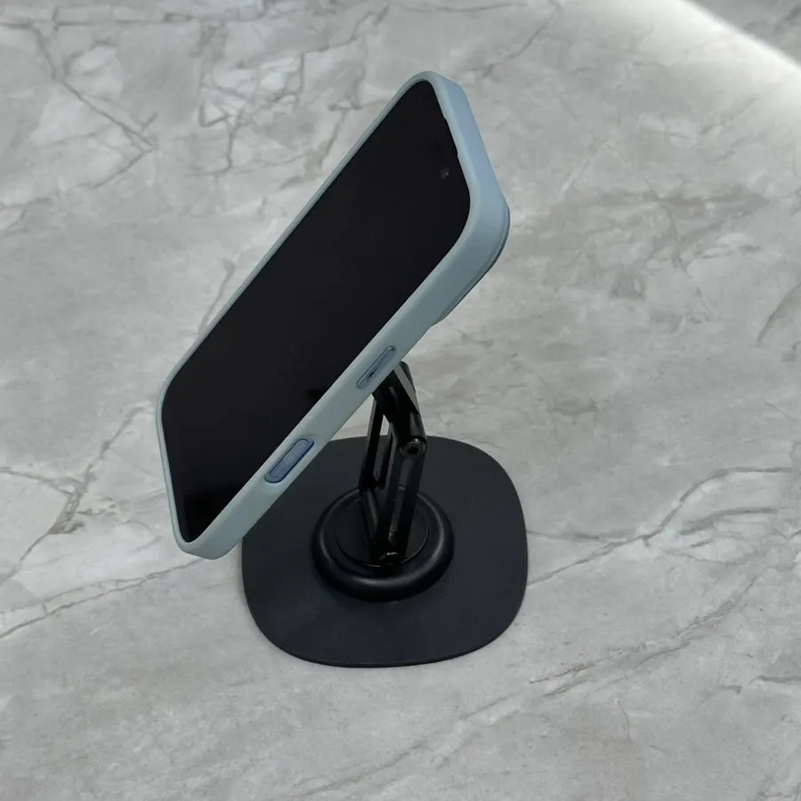Stand used with a tablet in adjustable portrait and landscape orientations