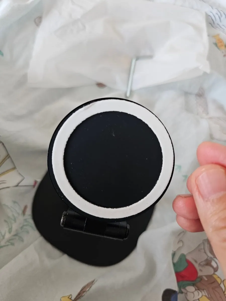 Smartphone stand with a charging cable connected