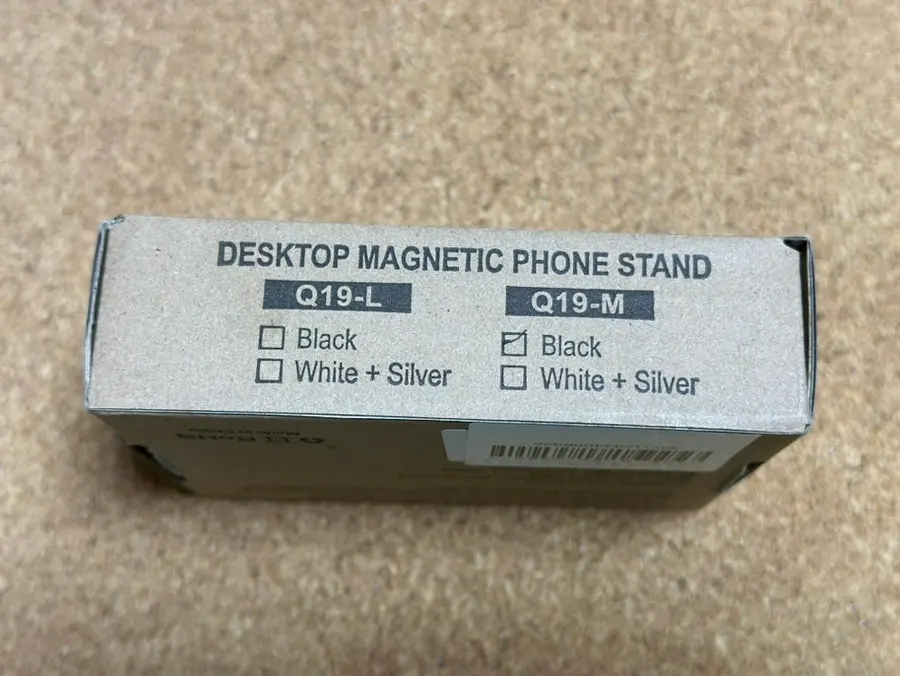 MagSafe phone stand holding a phone upright