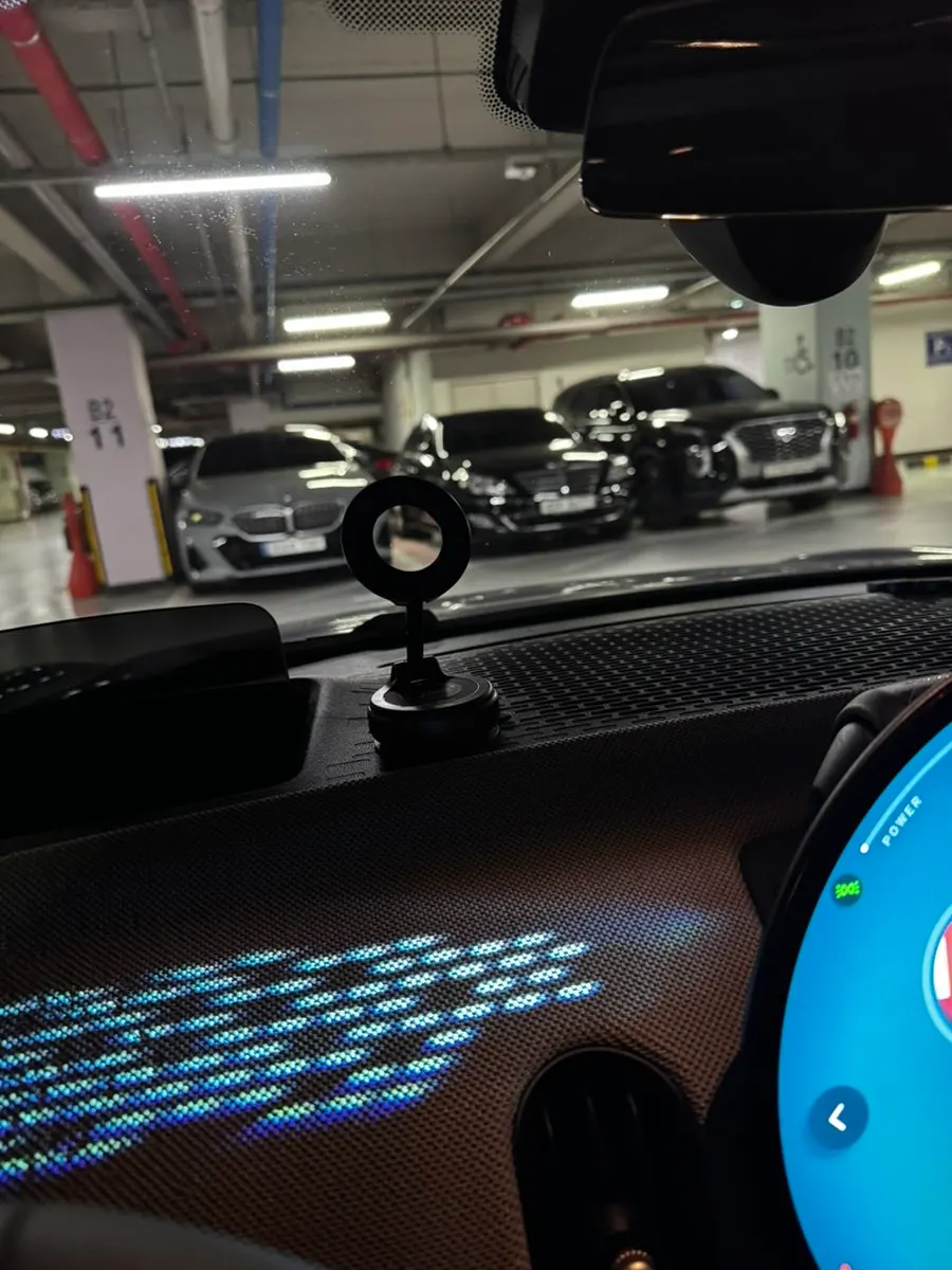 Car mount holding a smartphone magnetically