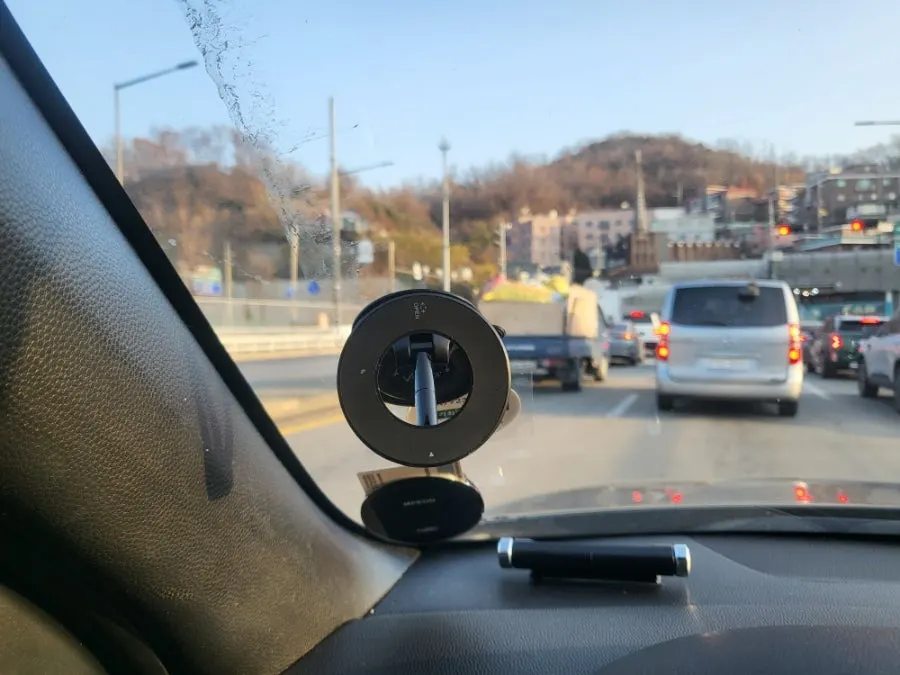 Photo related to a phone being secured by the MagSafe mount
