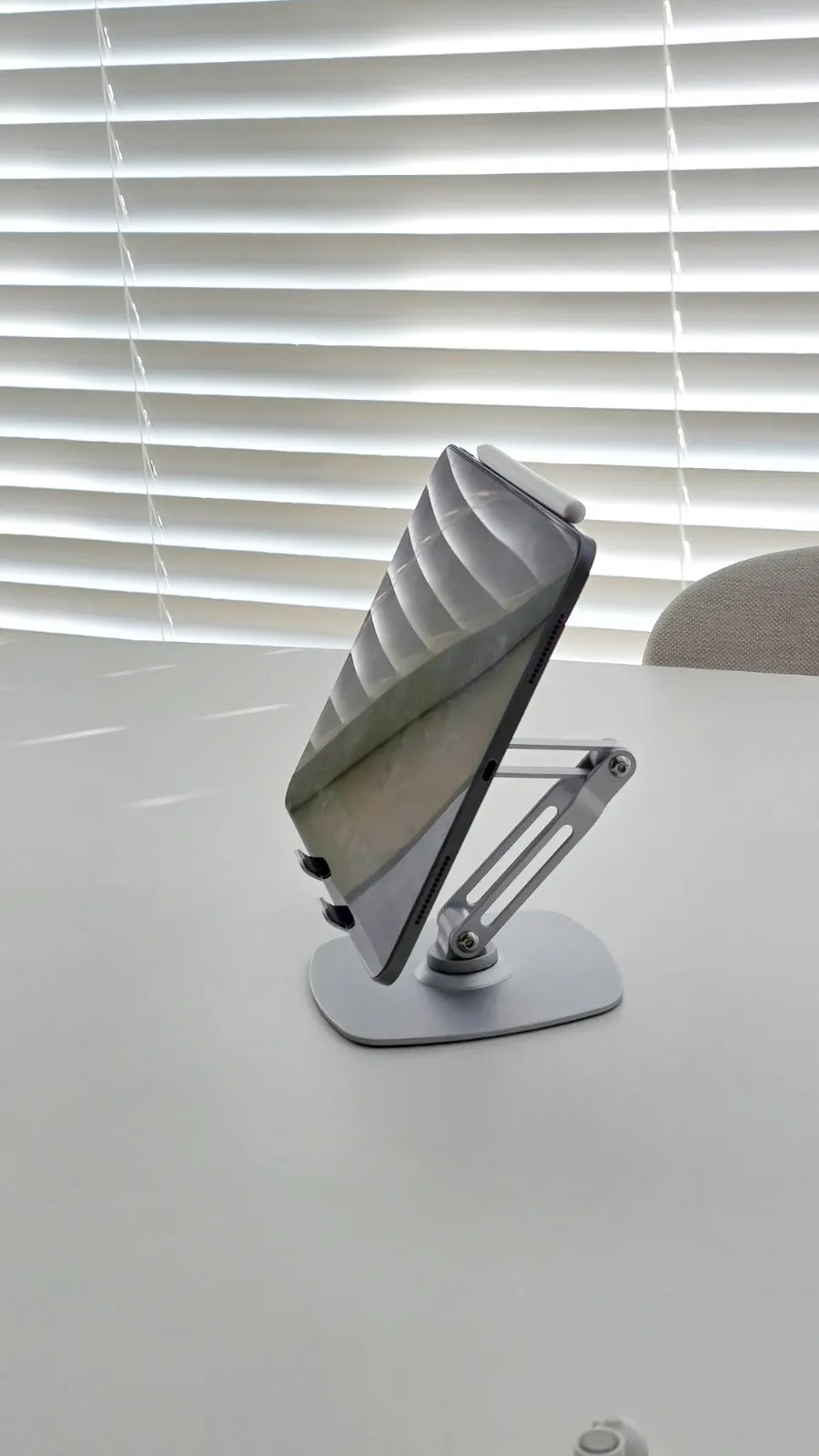 Metal stand holding a tablet