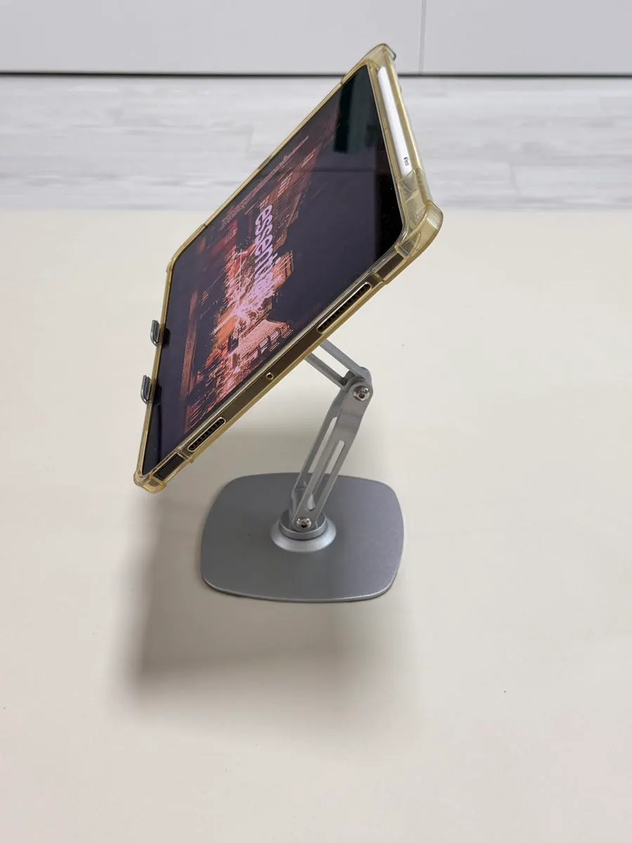 Tablet stand with rotation and angle-adjustment functions
