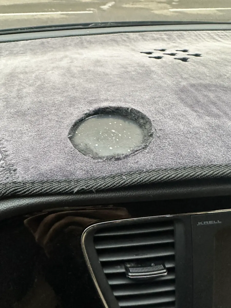 Mount base attached beneath the dashboard cover