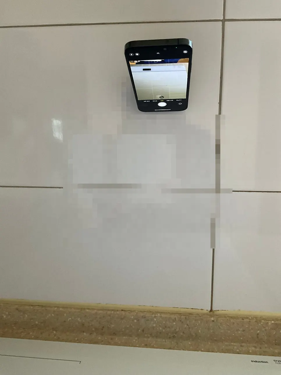 Phone mounted in the kitchen