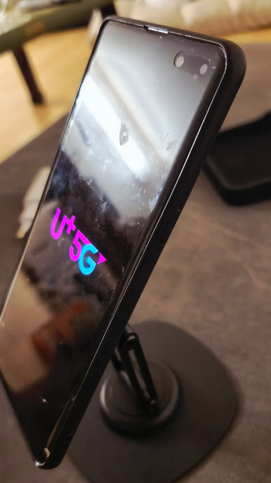Metal stand with adjustable smartphone angle