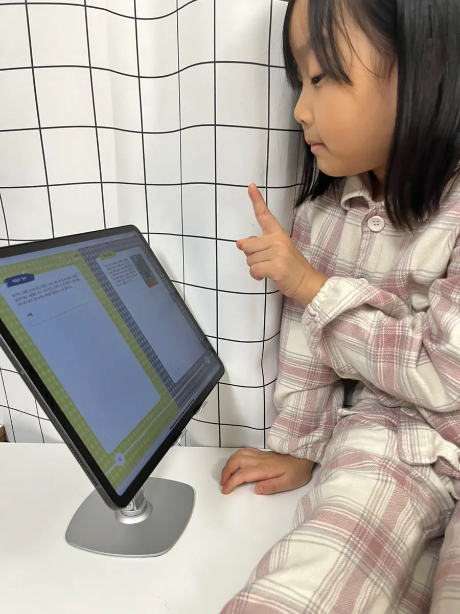 Tablet stand in use for watching videos