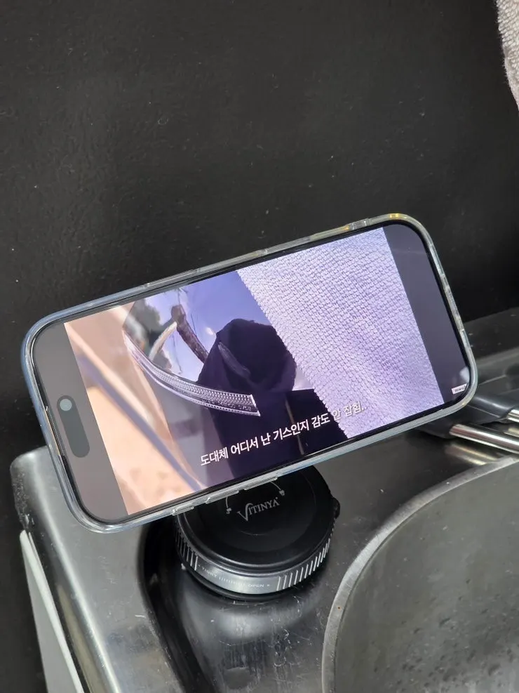 Smartphone mounted for filming and watching videos