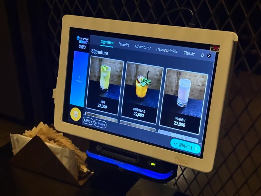 The paper menu placed at the bar seats