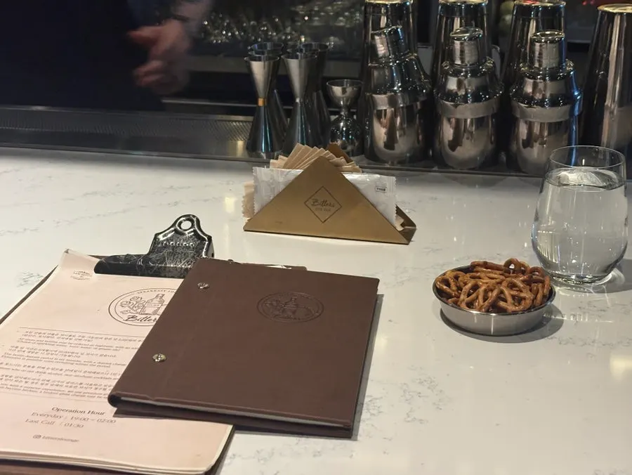 A menu page listing cocktails and whiskies