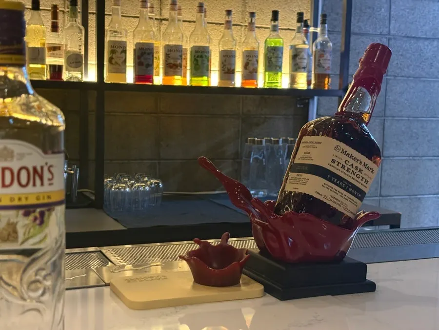 A whisky glass set on the bar counter