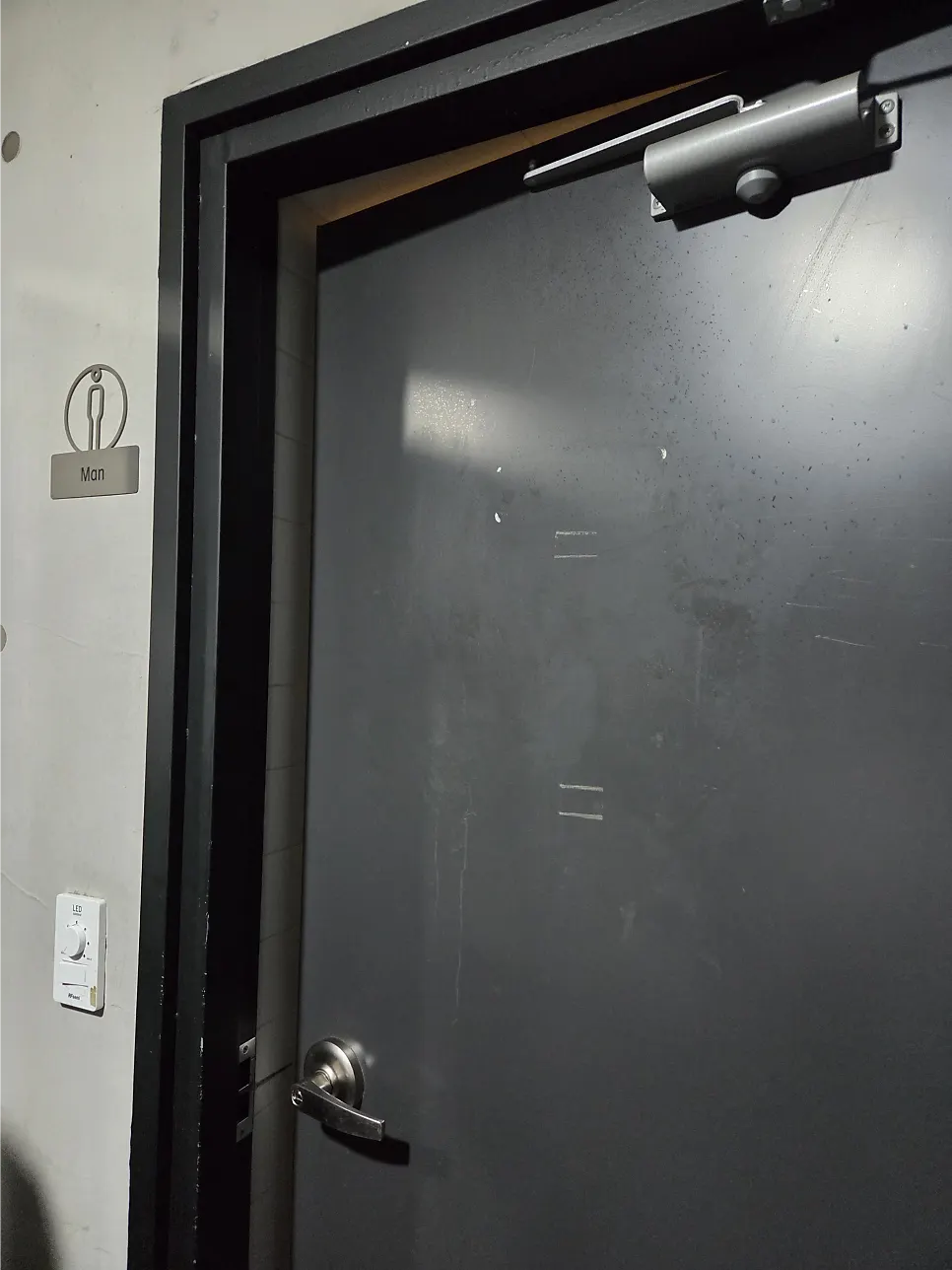 Sign for Bitters in the basement of Podo Building