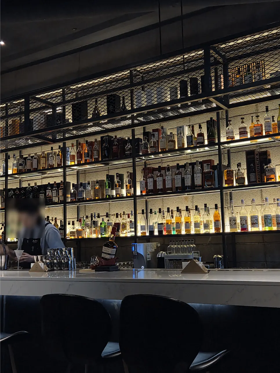 Bar seats and tables at Bitters
