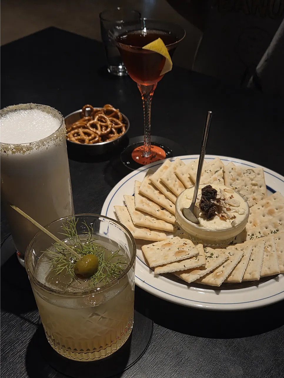 Cocktails and snacks on the table at Bitters