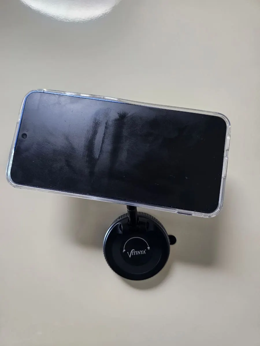 Smartphone mount attached to a surface