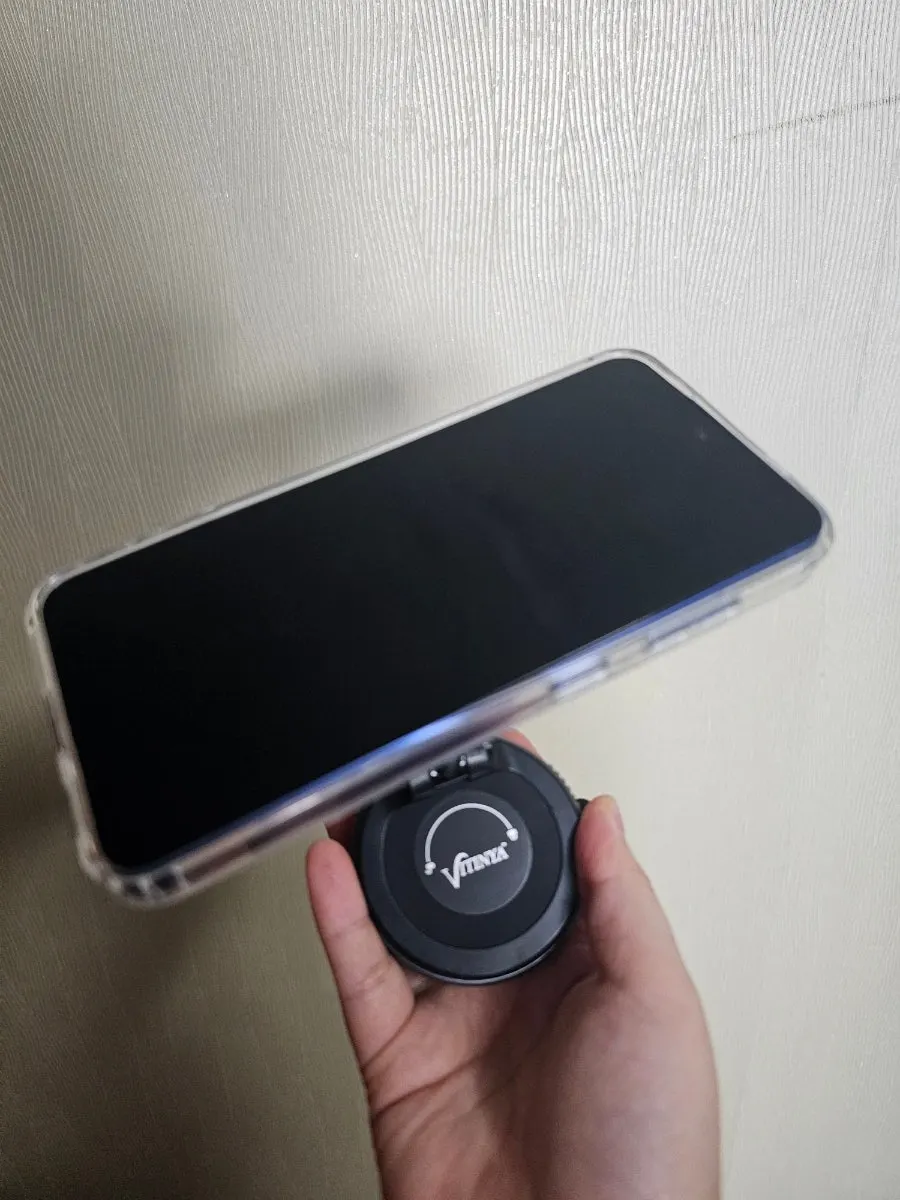Smartphone mount attached to a mirror