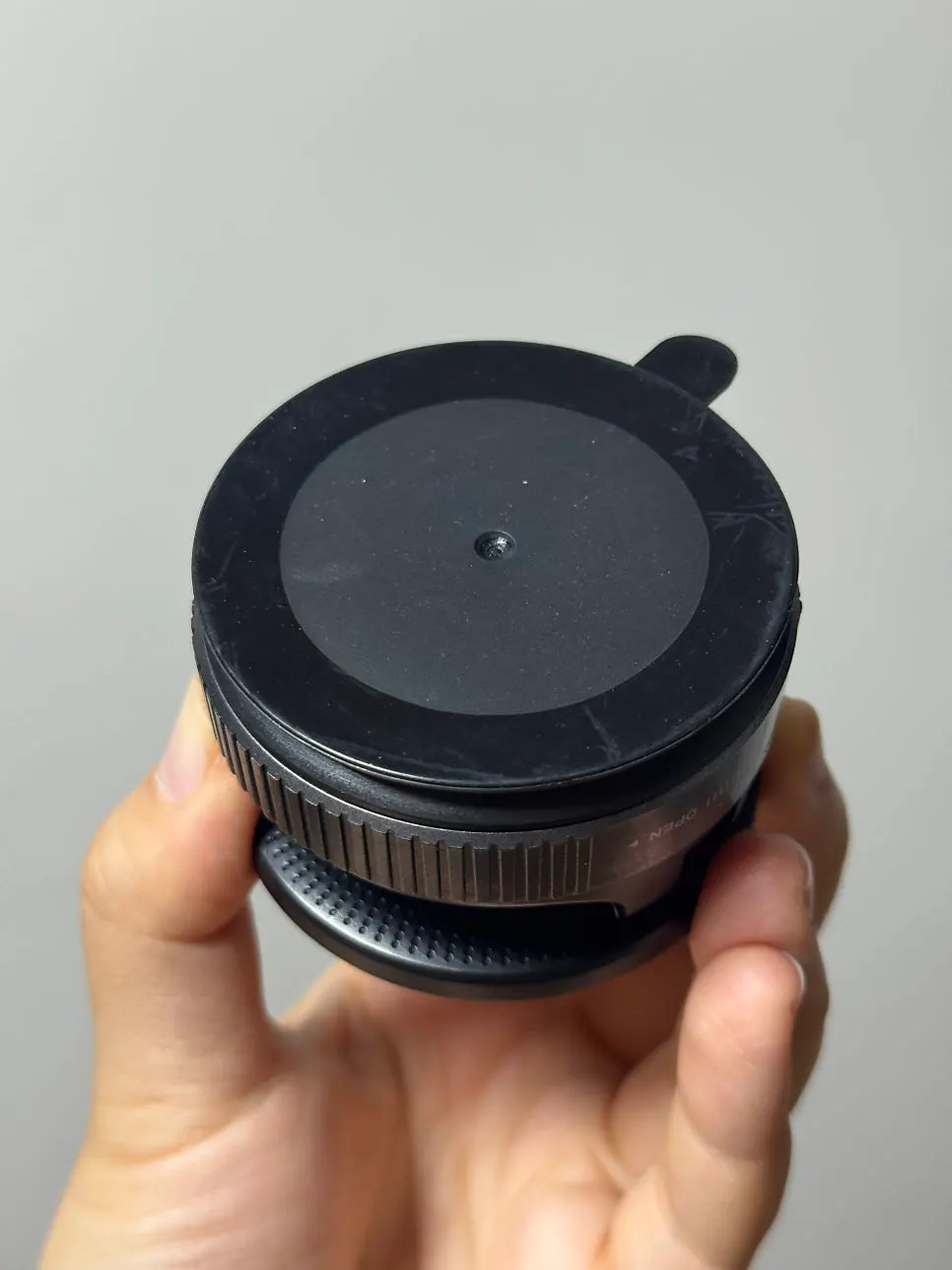 Using a car phone mount to remove a phone with one hand