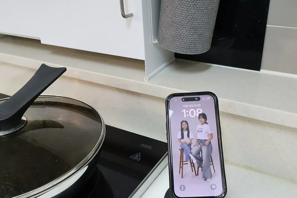 Phone stand placed beside a laptop