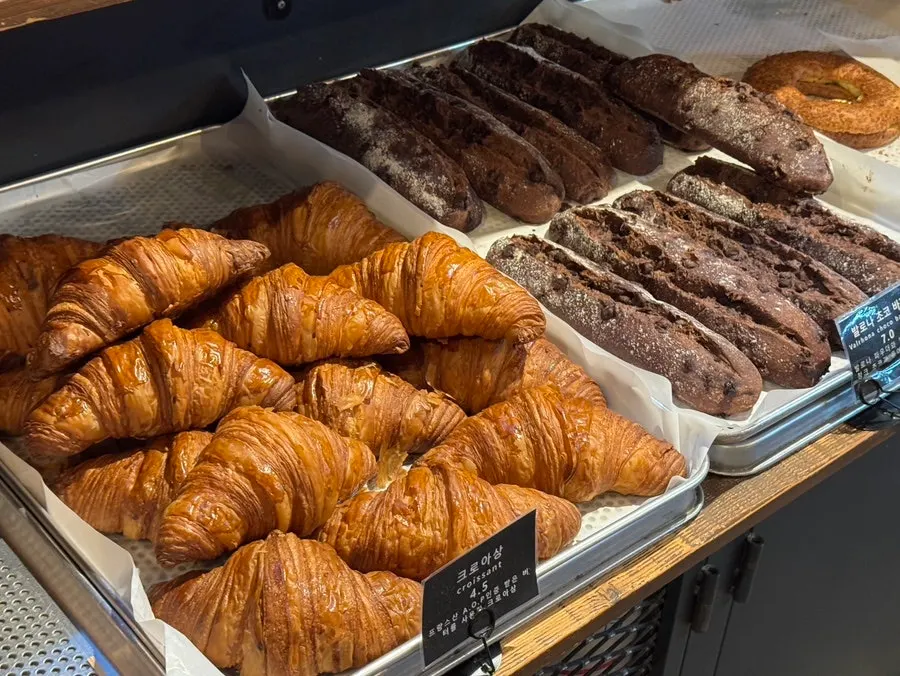 Brioche loaf and croissants on display
