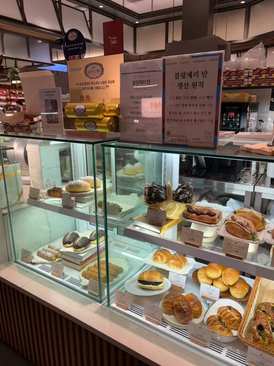 Bakery display case with baguettes and pastries