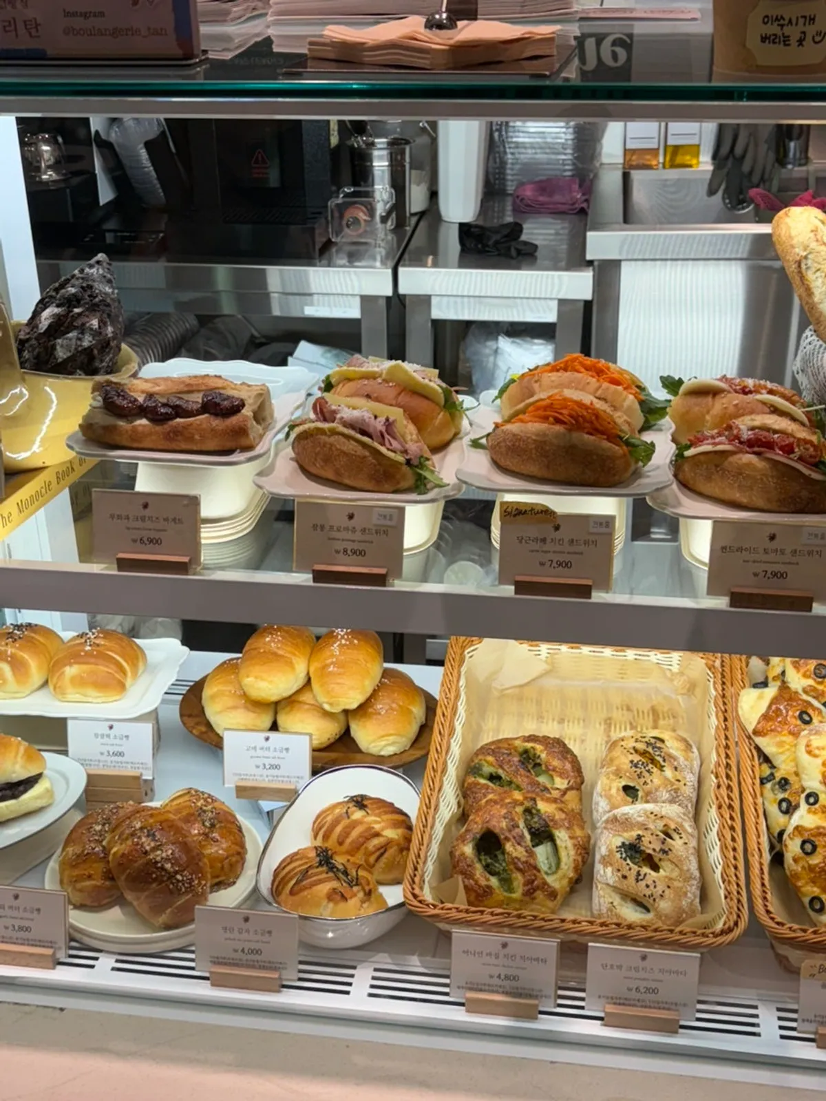 Showcase of sandwiches with carrot rapée and ham
