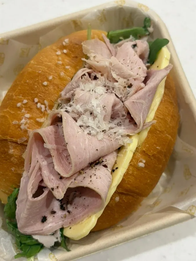 Two sandwiches made with baguette and salt bread