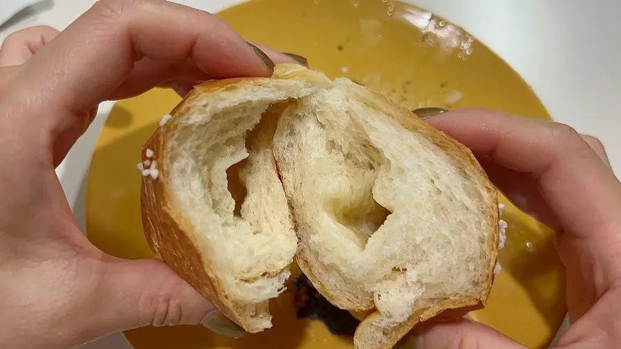 Salt bread split in half showing the moist interior