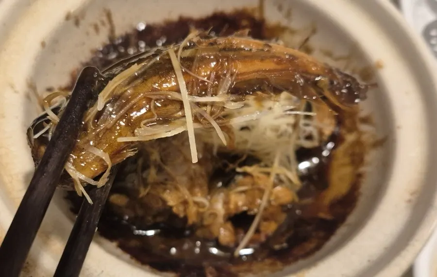 A piece of eel coated generously in the reduced sauce