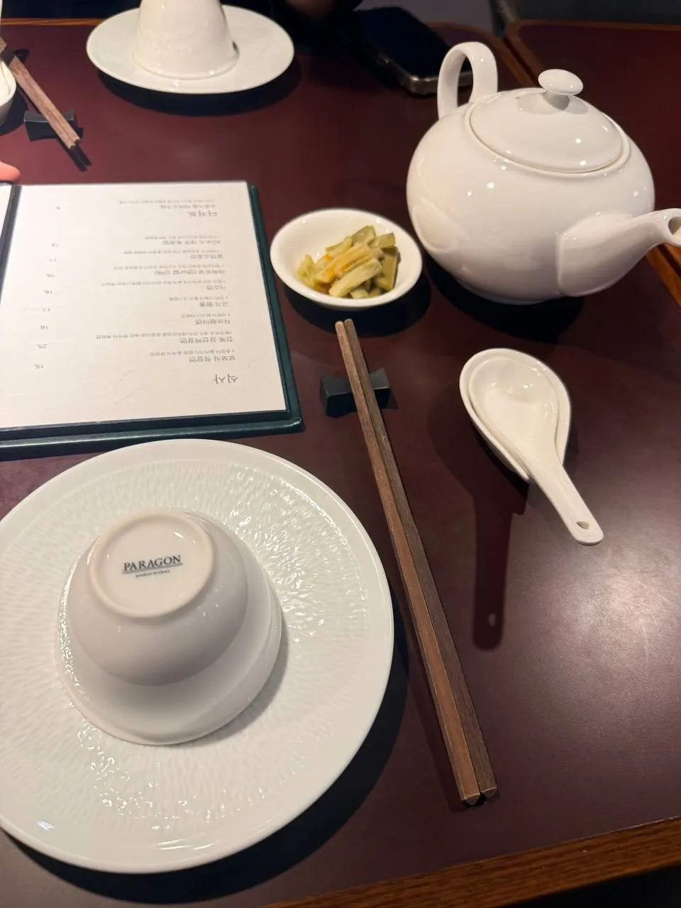 Single place setting with teapot and teacup