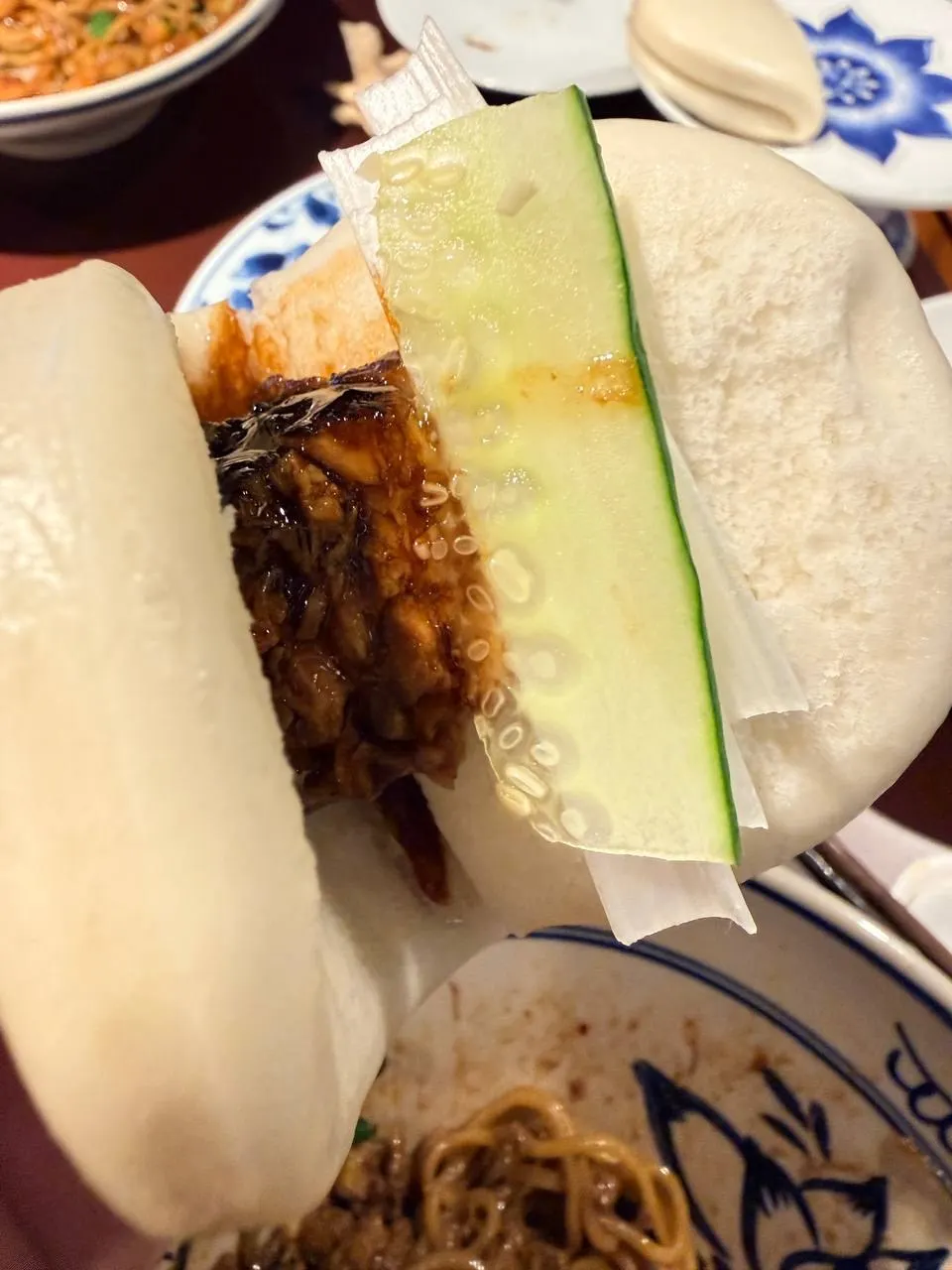 Close-up of 4-piece dongpo pork with soy sauce underneath