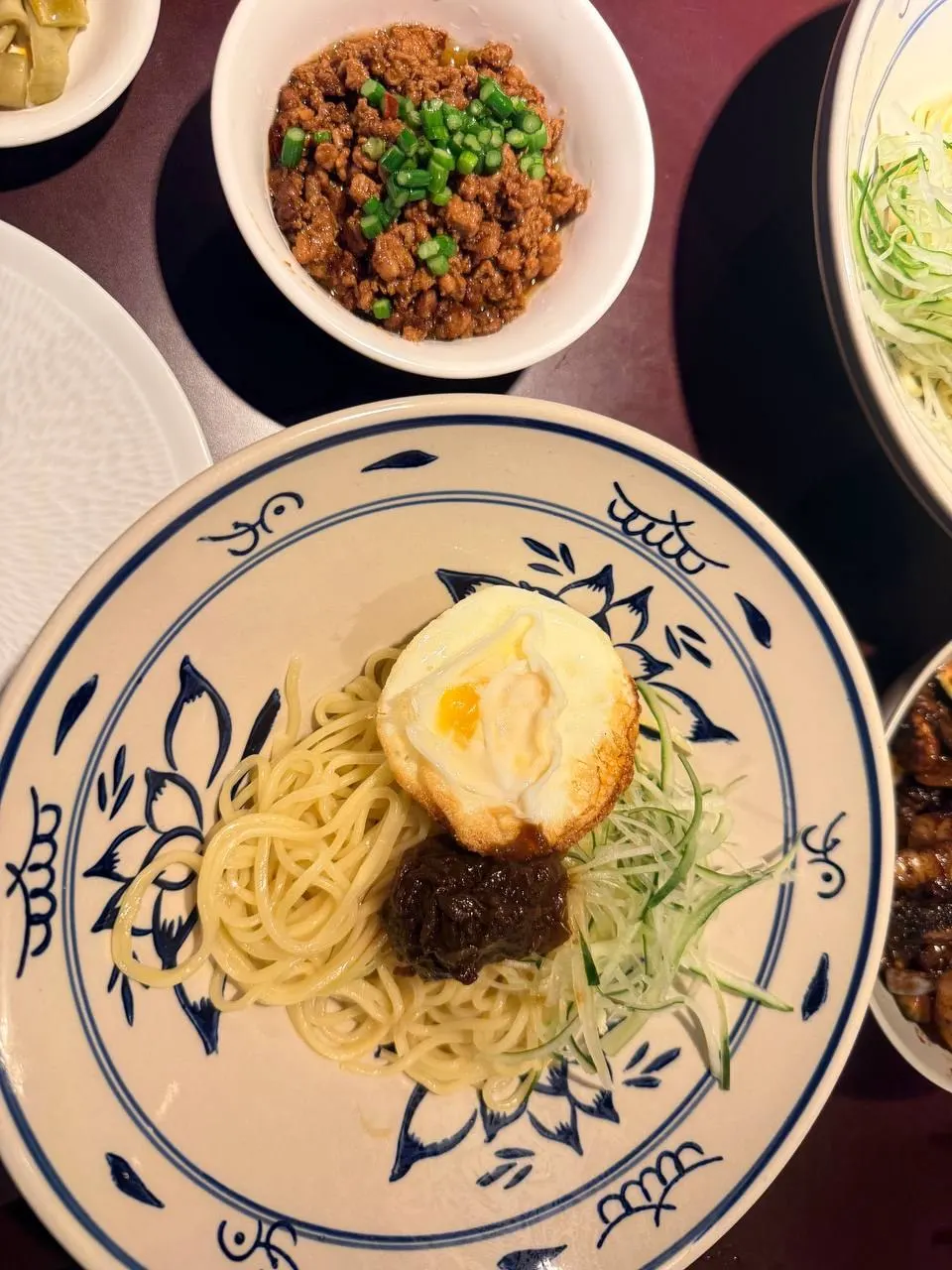 Halved flower bun stuffed with dongpo pork, cucumber, and scallion