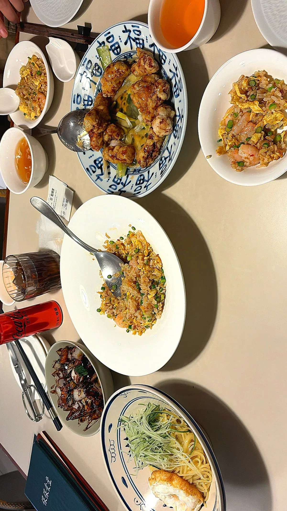 Table spread for two with sweet and sour pork, jjajangmyeon and fried rice