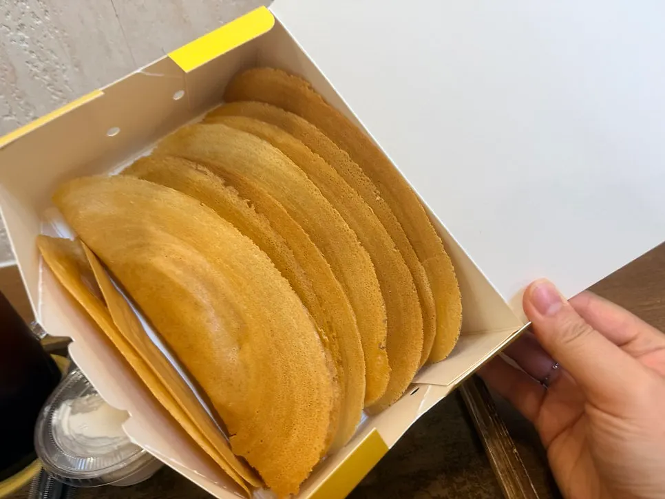 A bite of bocado topped with butter cream