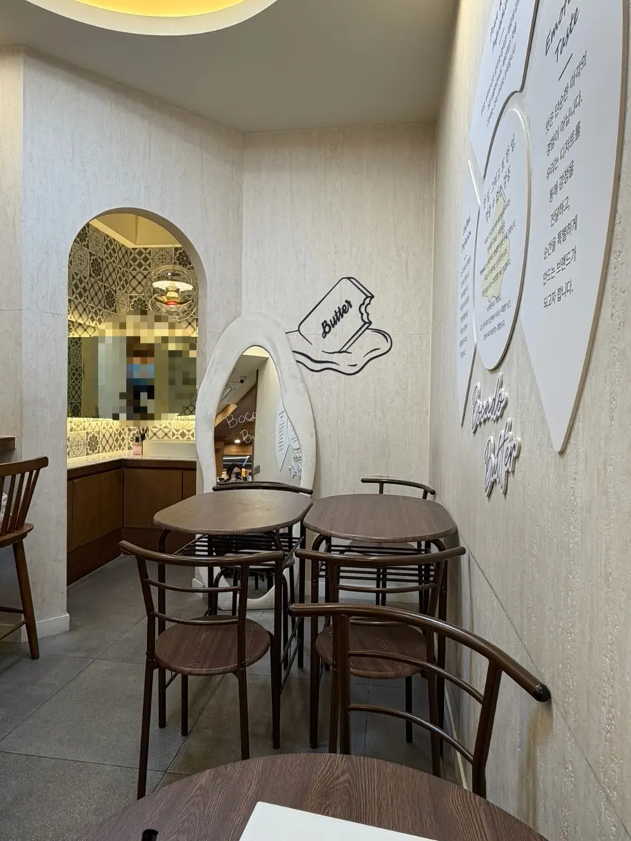 White and wood-toned handwashing area and table