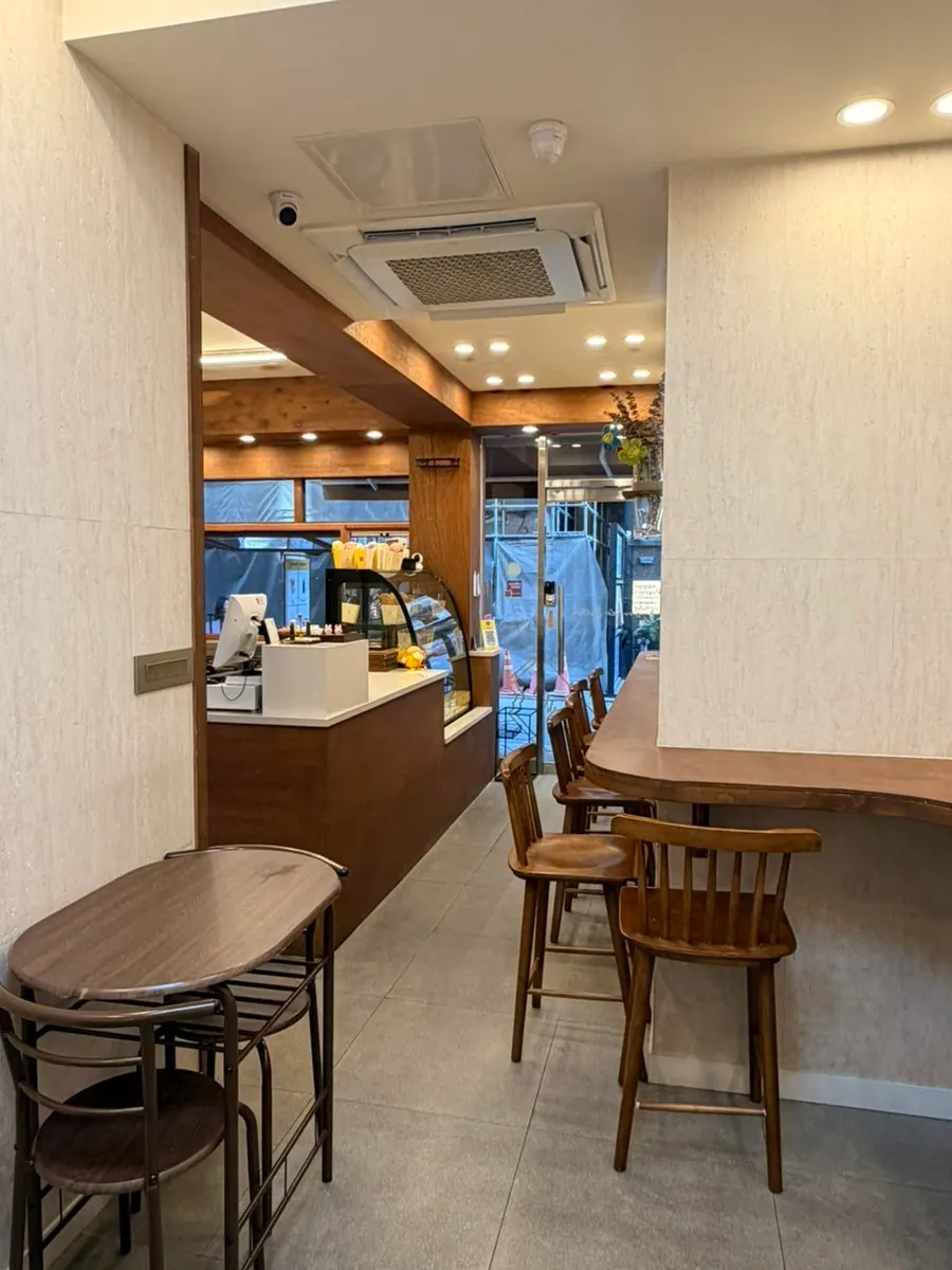 Café wall engraved with the brand logo and signage