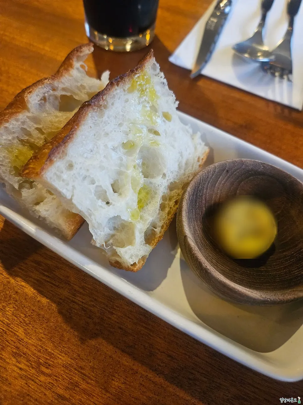 Freshly served sourdough and corn soup