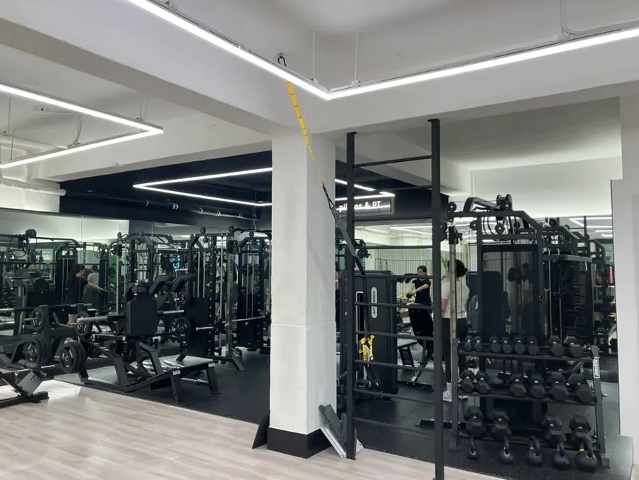 Interior split into a pilates zone and a PT zone