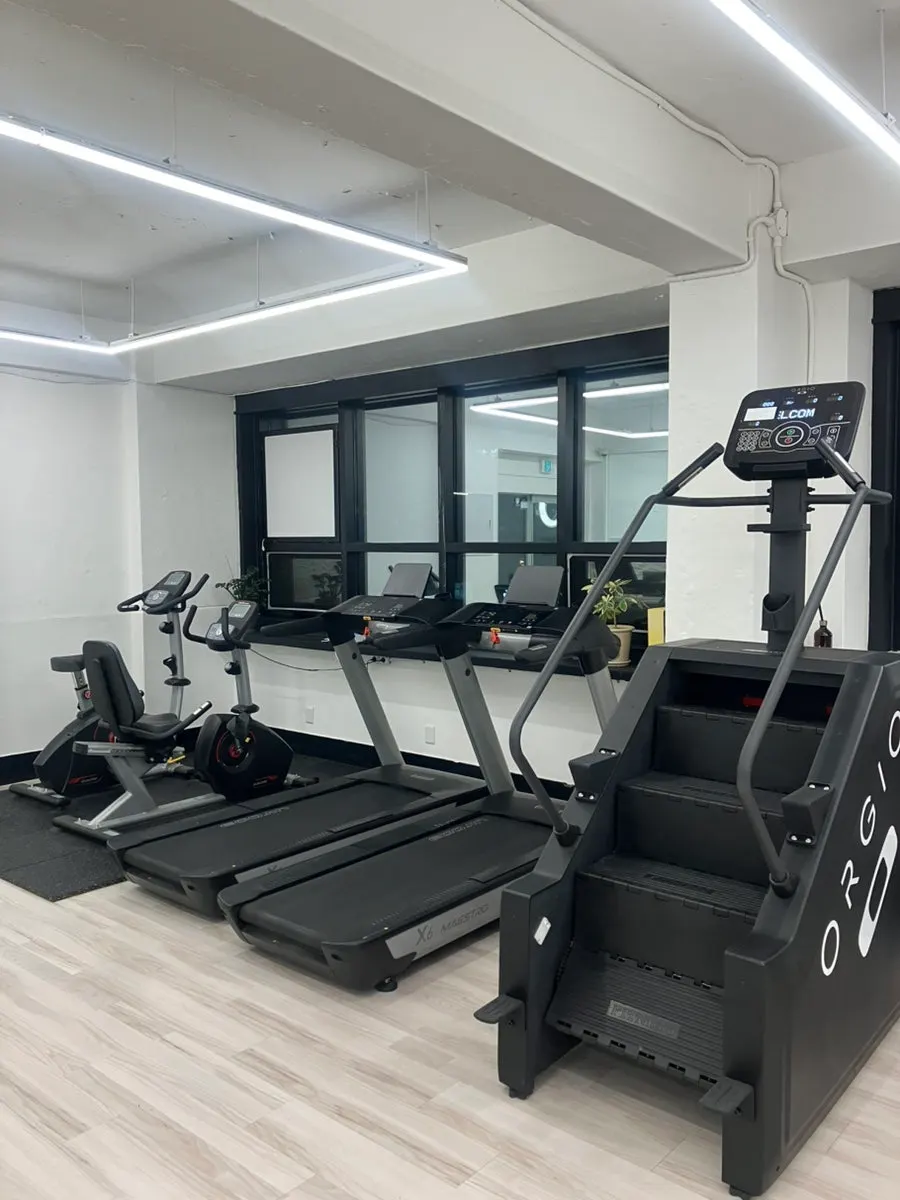 Open workout space with a full-length mirror