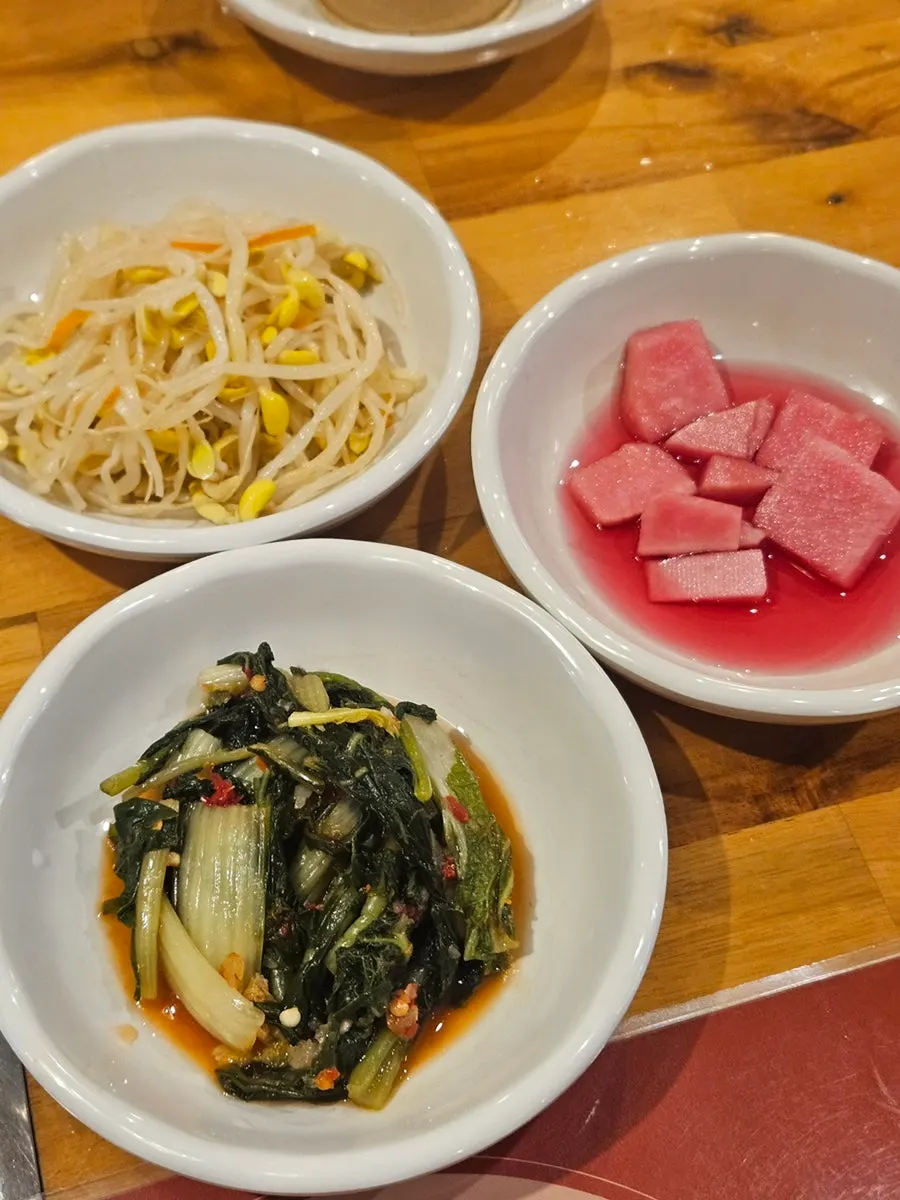 Basic side dishes including seasoned bean sprouts and young cabbage kimchi