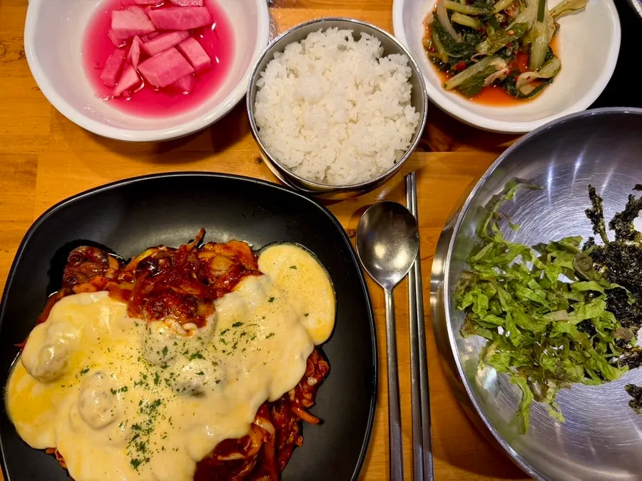 A full spread of the ordered fire-grilled octopus stir-fry